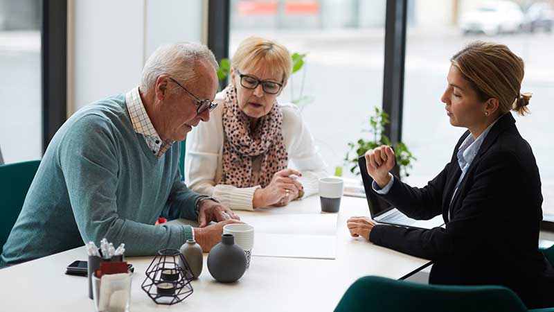 Advisor helping older couple