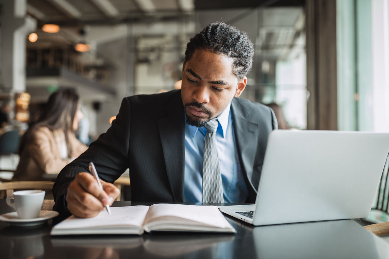 Man in front of laptop.