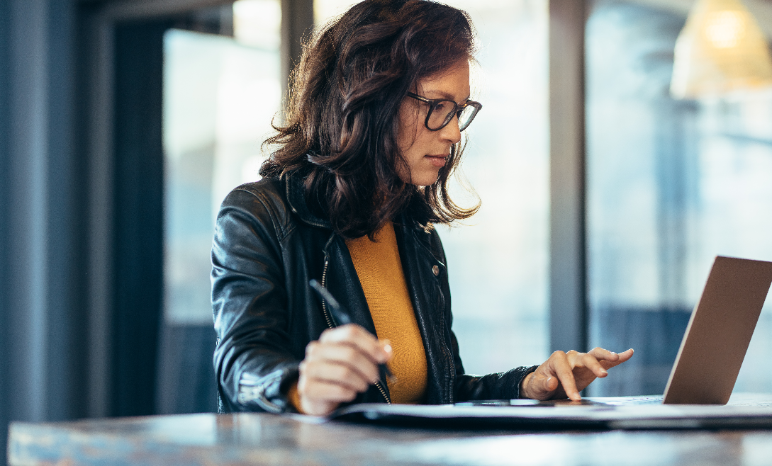 Woman in front of laptop.