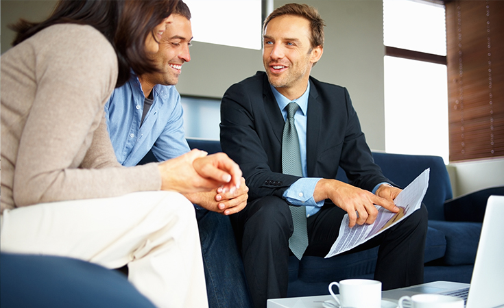 Three people looking at a file