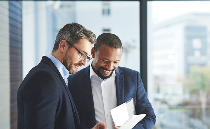 Three people looking at a file