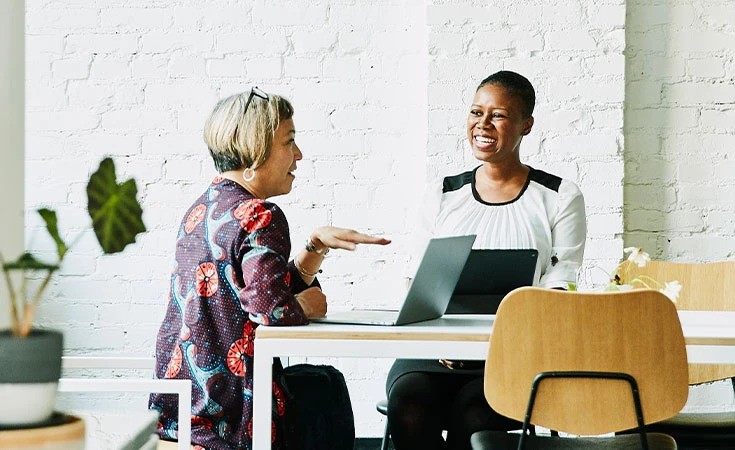 Two women in a modern office setting