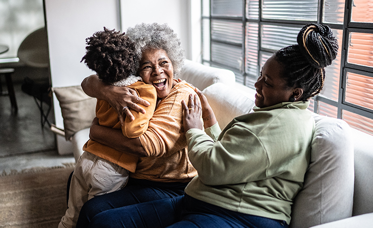 Family hugging and smiling