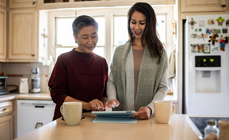 Mother and daughter viewing tablet